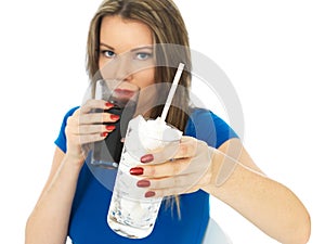 Young Woman Drinking High Sugar Fizzy Drink