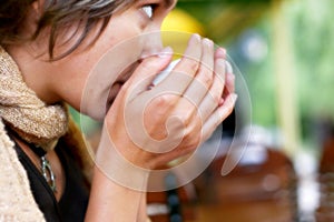Young woman drinking hot coffee