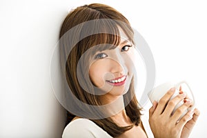 Young Woman drinking hot latte coffee