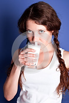 Young woman drinking a milk