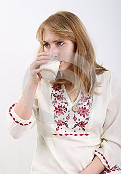 Young woman drinking milk