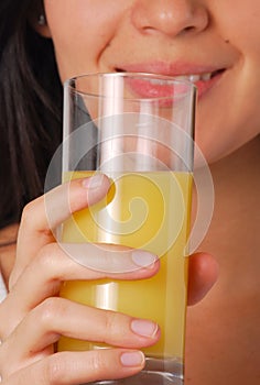 Young woman drinking orange juice