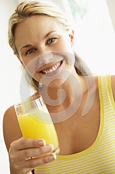 Young Woman Drinking Orange Juice