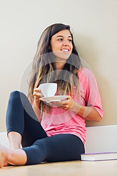 Young woman drinking tea