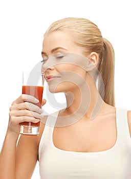 Young woman drinking tomato juice