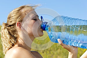 Young woman drinking water