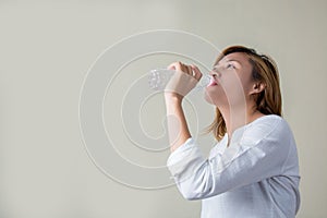 Young woman drinking water look so fresh