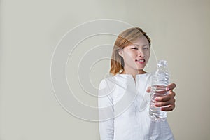 Young woman drinking water look so fresh