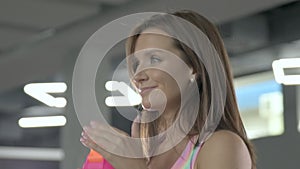 Young woman drinking water outdoor at sport playground