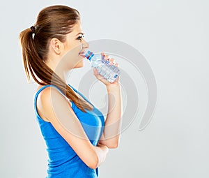 Young woman drinking water profile portrait