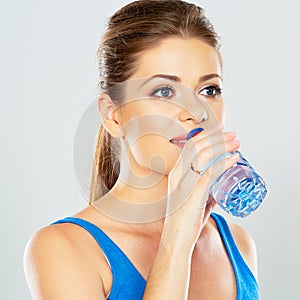 Young woman drinking water profile portrait