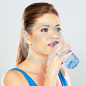 Young woman drinking water profile portrait