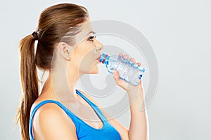 Young woman drinking water profile portrait