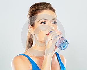 Young woman drinking water profile portrait