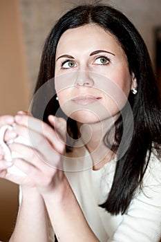 Young woman drinks tea