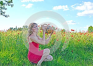 Young woman drinks water from pitcher on hot summer day