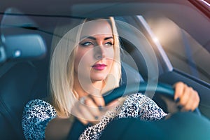 Young woman driving a car