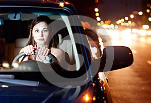 Young woman driving car