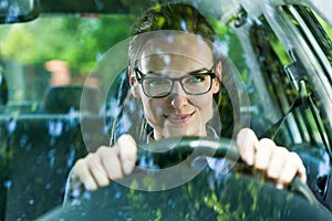 Young woman driving a car