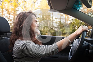 Young woman driving car