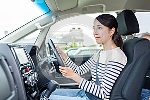 Young woman driving car