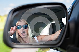 Young woman driving car