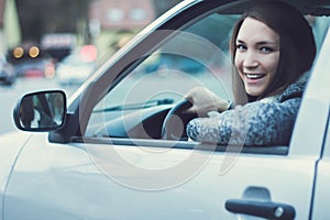 Young woman driving car in the city