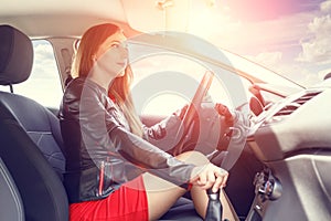 Young woman driving car. Fast delivery background
