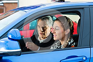 Young woman at driving lesson