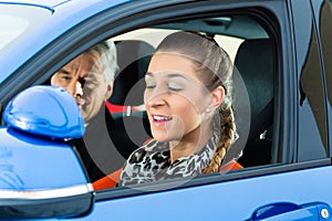 Young woman at driving lesson