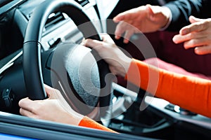 Young woman at driving lesson