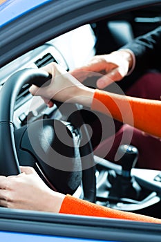 Young woman at driving lesson