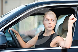 Young woman driving new car