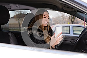 Young woman driwing car