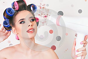 Young woman drying hair by hairdryer. Makeup and hairstyle.