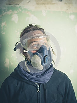 Young woman with dust mask and goggles