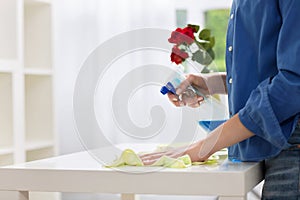 Young woman dusting