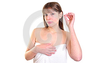 Young woman with ear cleaner to clean ear