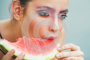 Young woman eat juicy watermelon melon. Sexy summer tropical fruit. Young beautiful funny model on vacation holiday