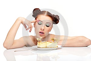Young woman eat tasty cake