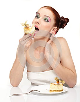 Young woman eat tasty cake