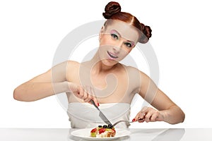 Young woman eat tasty cake