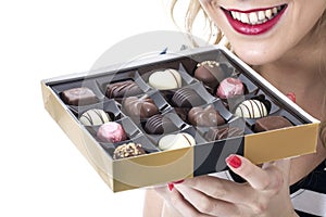 Young Woman Eating Box of Chocolates