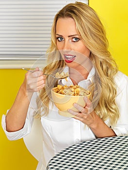 Young Woman Eating Breakfast Cereal