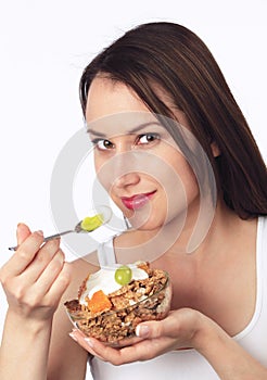 Young woman eating breakfast cereals