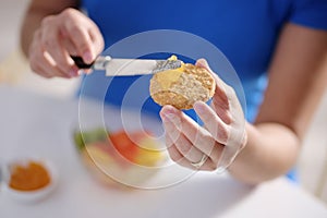 Young Woman Eating Breakfast At Home On Sunday