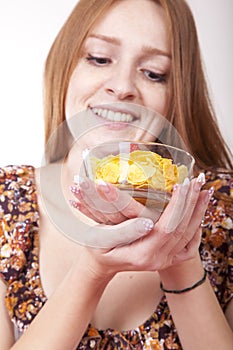 Young woman eating cereals