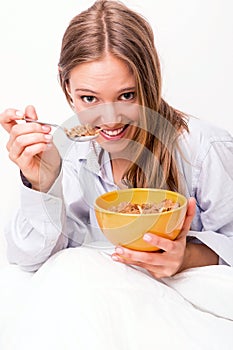 Young woman eating cereals