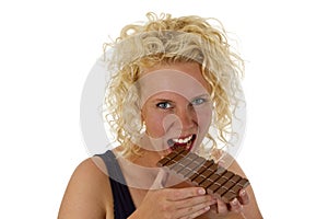 Young woman eating chocolate