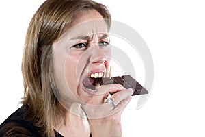 Young woman eating chocolate